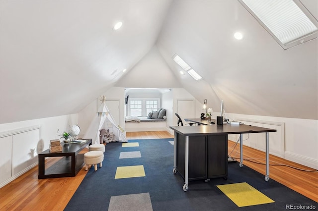 home office with dark hardwood / wood-style floors and vaulted ceiling