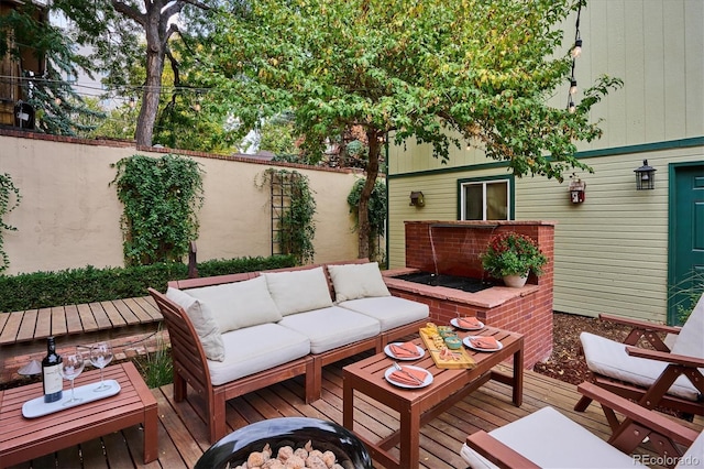 wooden terrace featuring an outdoor hangout area