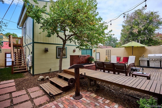 exterior space with outdoor lounge area and a deck