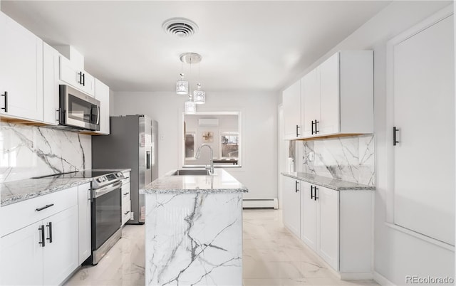 kitchen with a center island with sink, marble finish floor, baseboard heating, stainless steel appliances, and a sink