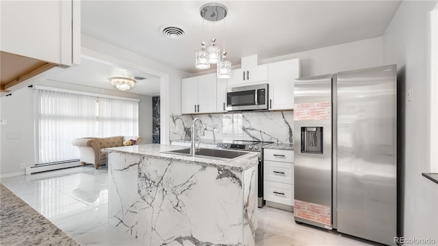 kitchen with light stone counters, a baseboard heating unit, stainless steel appliances, white cabinets, and marble finish floor