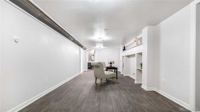 hallway with baseboards and wood finished floors