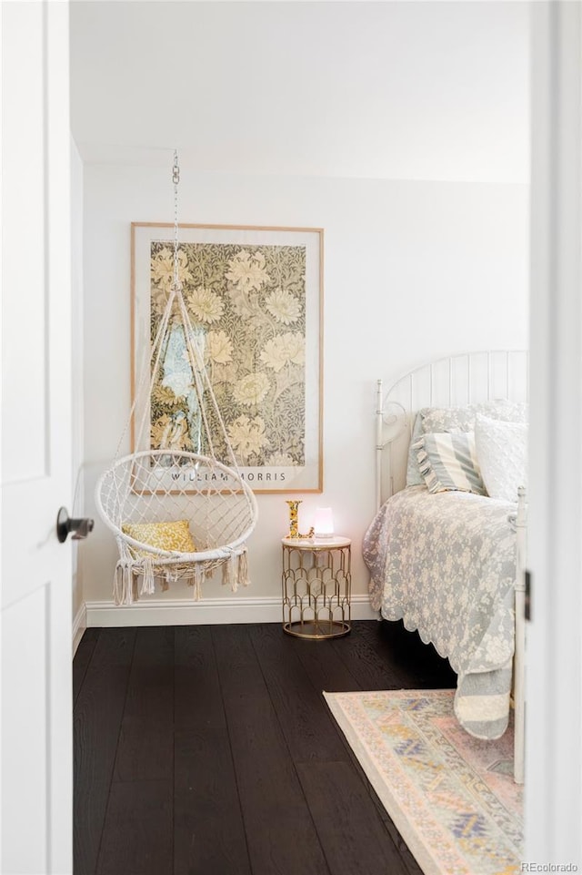 bedroom with wood-type flooring