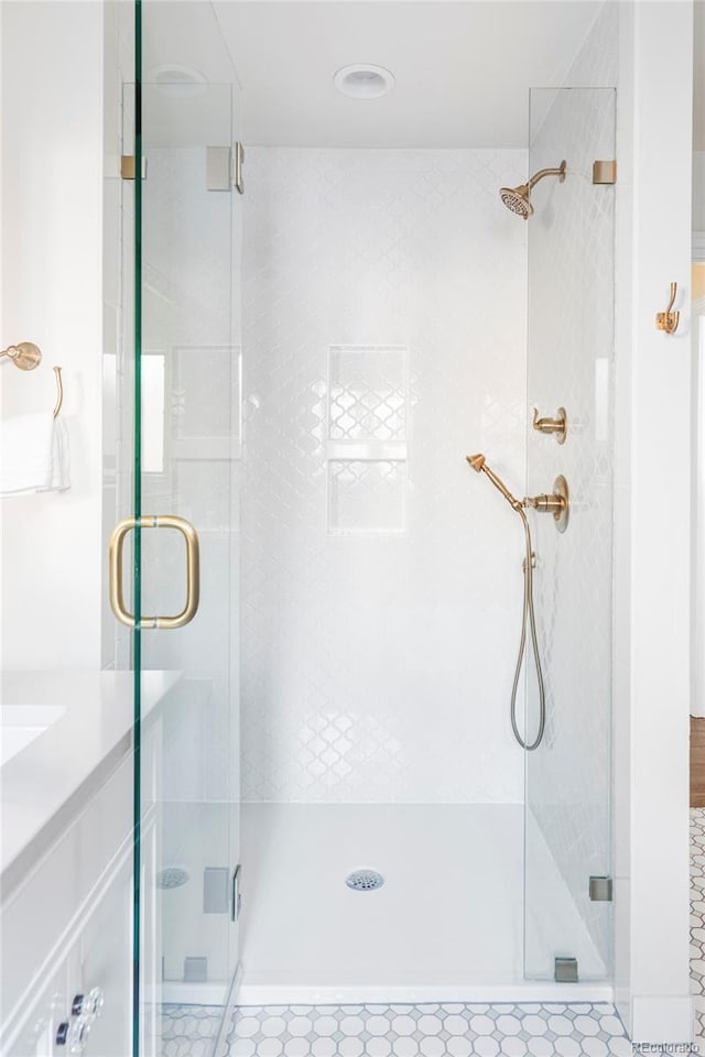 bathroom with a shower with shower door