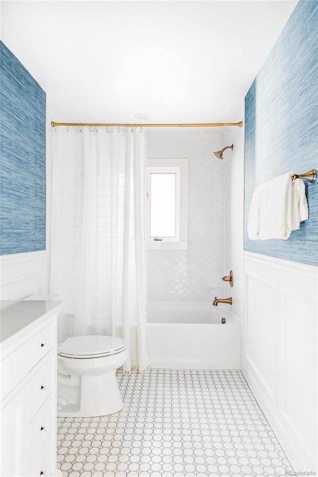 full bathroom featuring shower / bath combination with curtain, vanity, and toilet