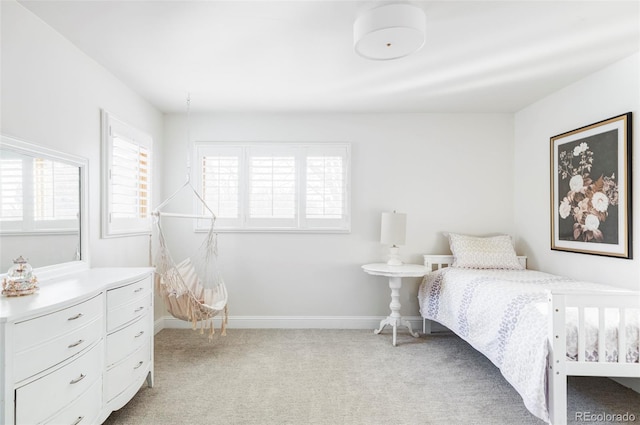 bedroom featuring light colored carpet