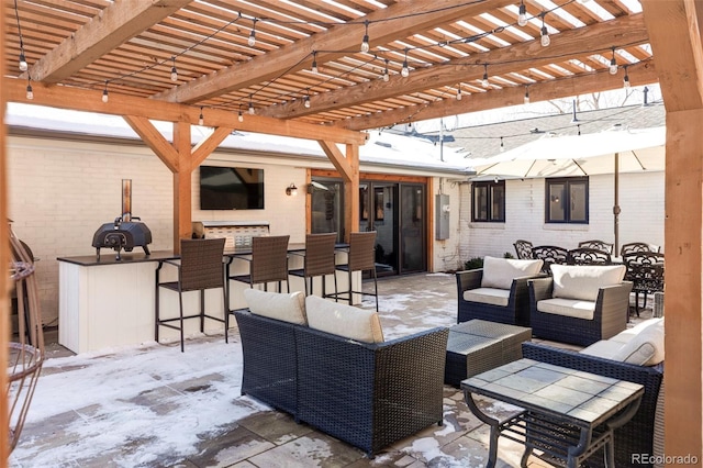 view of patio with a bar, a pergola, and an outdoor hangout area