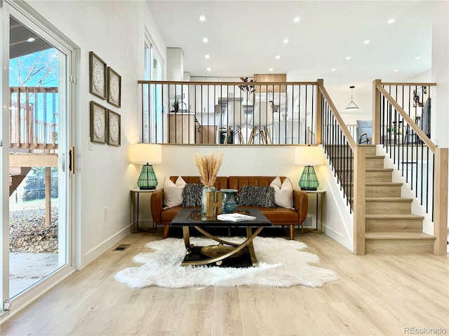 interior space featuring plenty of natural light and light hardwood / wood-style flooring