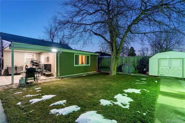 view of yard with a shed and a patio