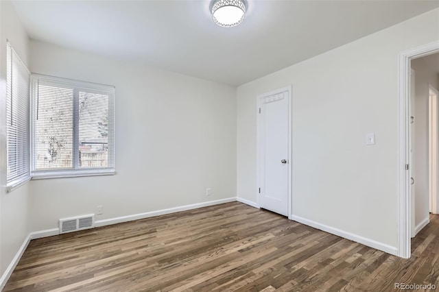 spare room featuring hardwood / wood-style flooring