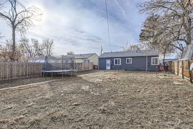 back of property with a trampoline