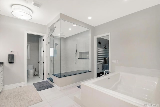 full bathroom featuring tile patterned floors, vanity, separate shower and tub, and toilet