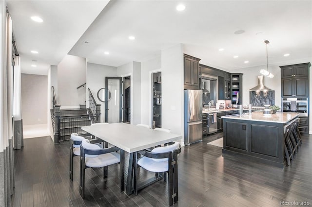 dining space with sink and dark hardwood / wood-style flooring