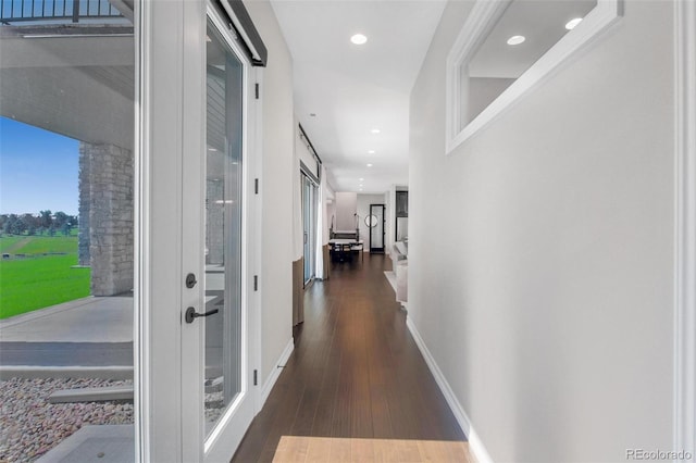 hall with dark hardwood / wood-style flooring