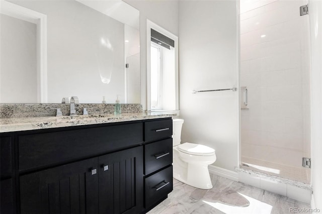 bathroom with toilet, a shower with door, and vanity