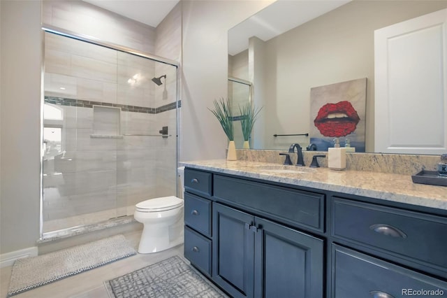 bathroom with tile patterned floors, toilet, vanity, and a shower with shower door