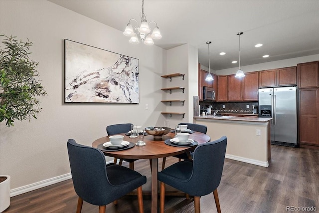dining room featuring recessed lighting, baseboards, dark wood-style floors, and an inviting chandelier