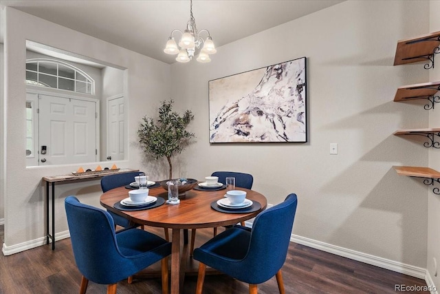 dining space with dark wood-style flooring, baseboards, and an inviting chandelier