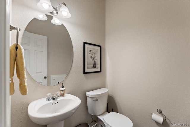 bathroom with a sink and toilet