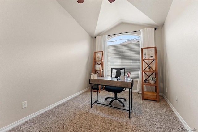 office featuring light colored carpet, baseboards, ceiling fan, and vaulted ceiling