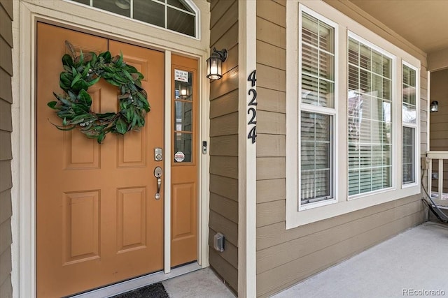property entrance with covered porch