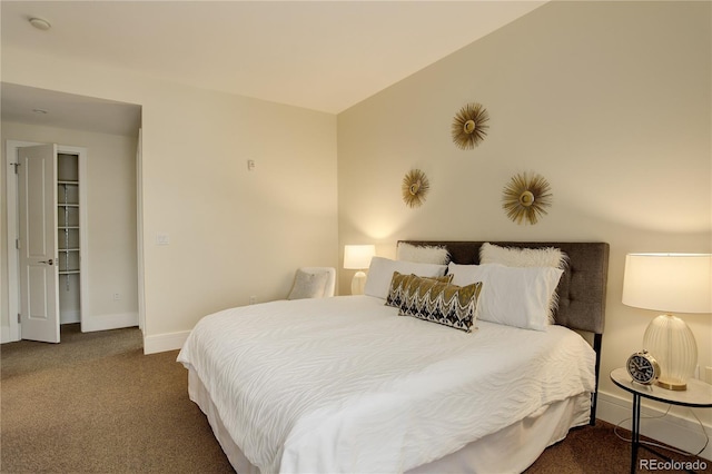 carpeted bedroom featuring baseboards