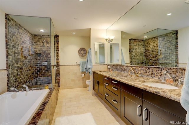 bathroom with tile walls, a bath, toilet, recessed lighting, and tile patterned floors