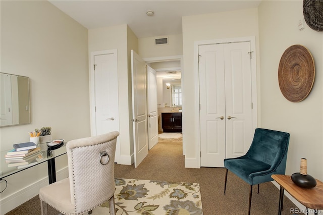 carpeted home office with baseboards