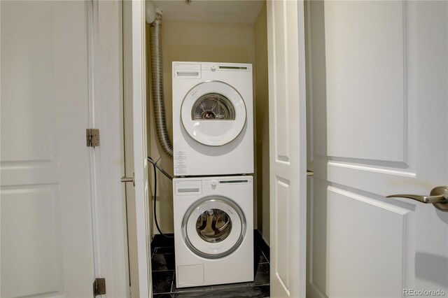 laundry area featuring stacked washer / dryer