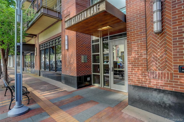191 Clayton Ln Unit 402, Denver, CO 80206 - view of exterior entry with brick siding