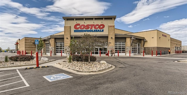 view of building exterior with uncovered parking