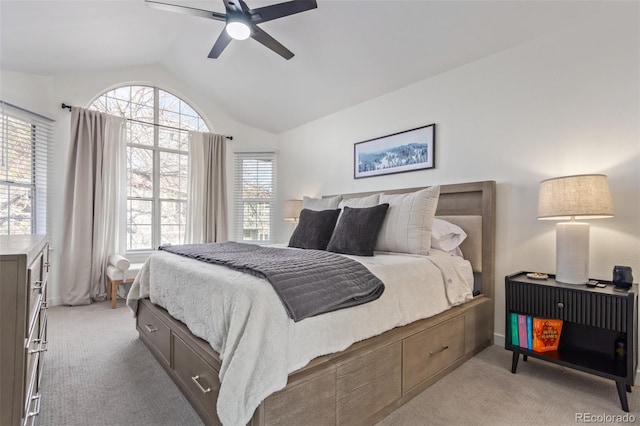 carpeted bedroom featuring ceiling fan and lofted ceiling