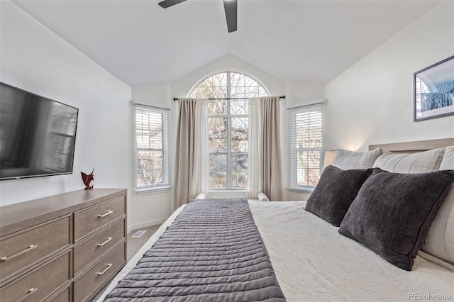 carpeted bedroom featuring ceiling fan and lofted ceiling