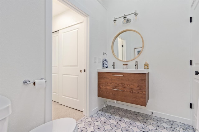 bathroom with vanity and toilet