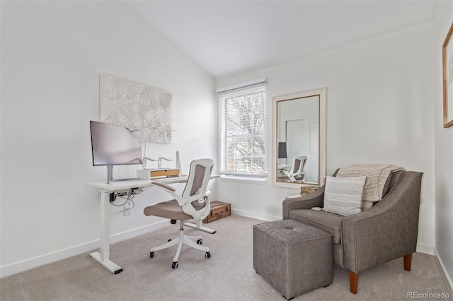 carpeted office space featuring lofted ceiling