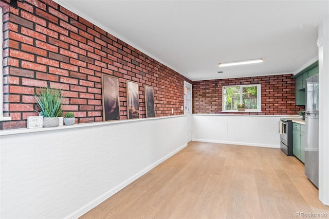 1413 S Bryan Ave, Fort Collins, CO 80521 - corridor with light wood-style flooring, brick wall, and crown molding