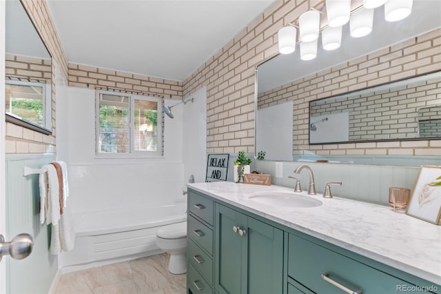 1413 S Bryan Ave, Fort Collins, CO 80521 - bathroom with vanity, bathtub / shower combination, and marble look tiles