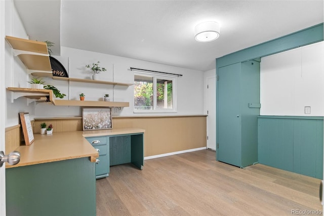 1413 S Bryan Ave, Fort Collins, CO 80521 - kitchen featuring light wood-style floors, light countertops, a wainscoted wall, and open shelves