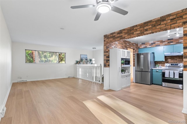 1413 S Bryan Ave, Fort Collins, CO 80521 - unfurnished living room featuring light wood-style floors, ceiling fan, and brick wall