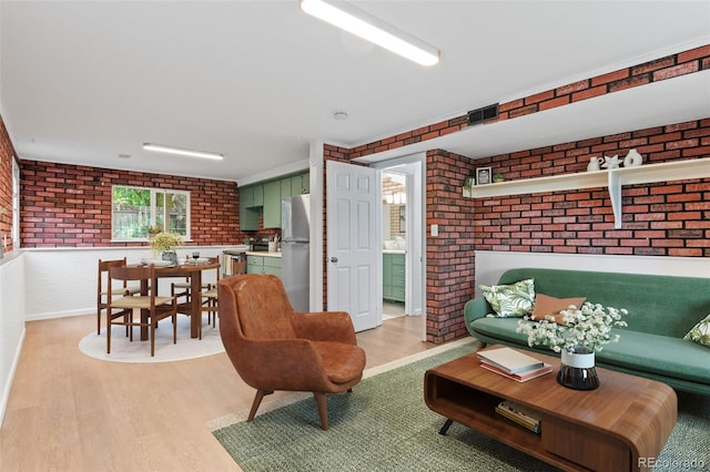 1413 S Bryan Ave, Fort Collins, CO 80521 - living area with brick wall and light wood-style floors