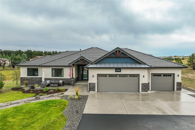 view of front of house with a garage and a front lawn