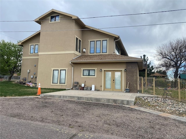 1123 S Quince Way, Denver, CO 80231 - rear view of property featuring french doors, a patio, and stucco siding