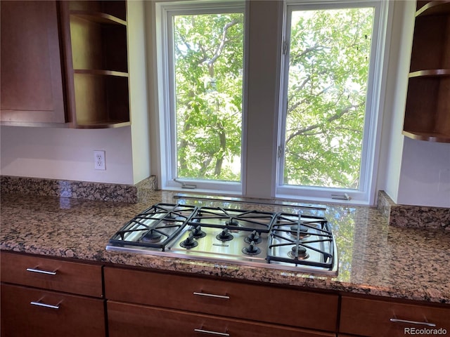 1123 S Quince Way, Denver, CO 80231 - kitchen with stainless steel gas stovetop, open shelves, and healthy amount of natural light