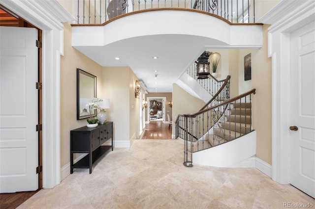 465 Monroe St, Denver, CO 80206 - foyer entrance with stairs, a towering ceiling, baseboards, and recessed lighting