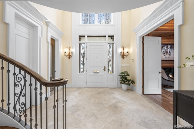 465 Monroe St, Denver, CO 80206 - foyer featuring baseboards and stairs