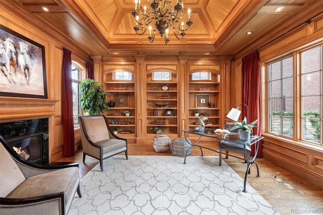 465 Monroe St, Denver, CO 80206 - office with built in shelves, ornamental molding, a fireplace, wood finished floors, and a chandelier