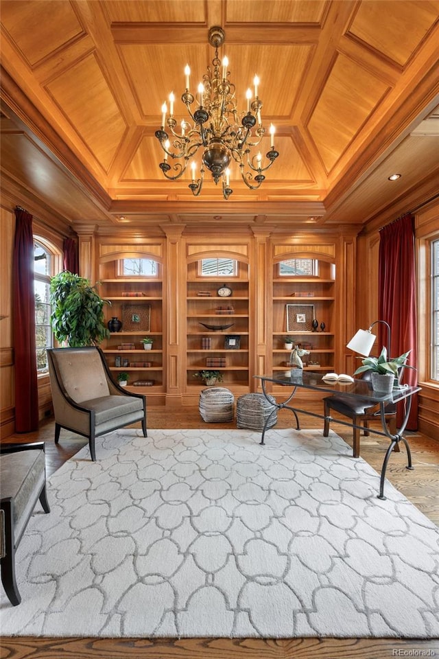 465 Monroe St, Denver, CO 80206 - living area featuring coffered ceiling, built in features, wood ceiling, crown molding, and a chandelier