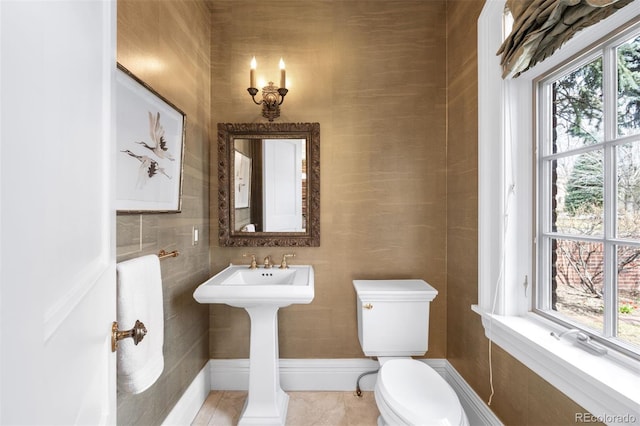 465 Monroe St, Denver, CO 80206 - half bathroom with toilet, tile patterned floors, and a sink