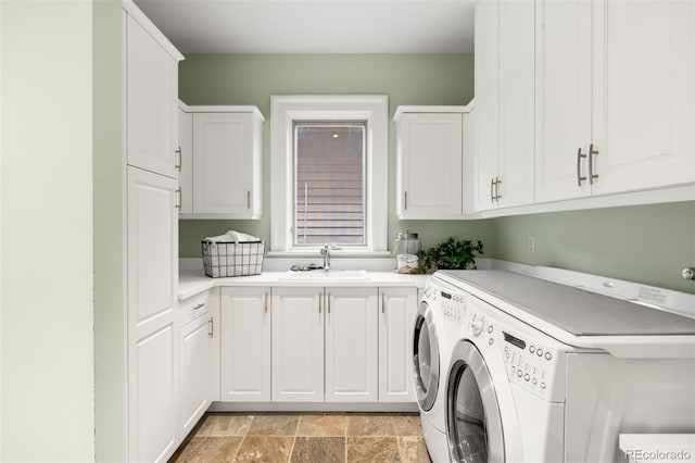 465 Monroe St, Denver, CO 80206 - laundry room with washing machine and clothes dryer, cabinet space, and light stone finish floors