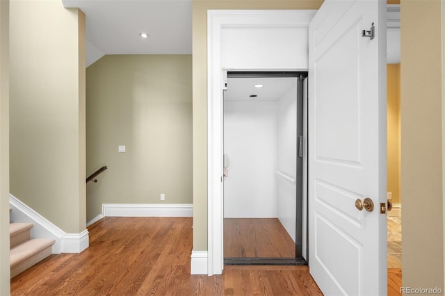 465 Monroe St, Denver, CO 80206 - hall with wood finished floors, an upstairs landing, baseboards, and recessed lighting